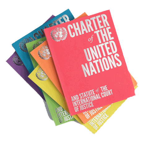 copies of the UN charter in a pile